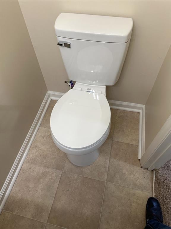 5956 North Castlegate Drive Atlanta, GA 30349 - Photo 15 of 28 a bathroom with a toilet and a mirror