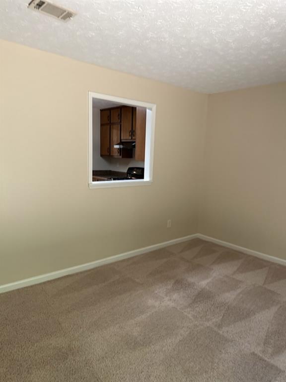 5956 North Castlegate Drive Atlanta, GA 30349 - Photo 17 of 28 a view of an empty room with a window