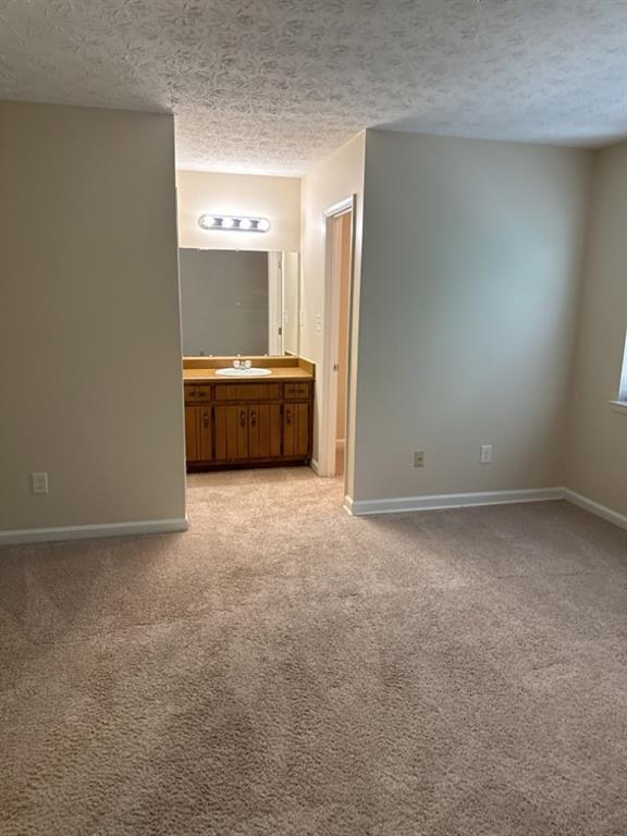 5956 North Castlegate Drive Atlanta, GA 30349 - Photo 18 of 28 a view of an empty room with a kitchen