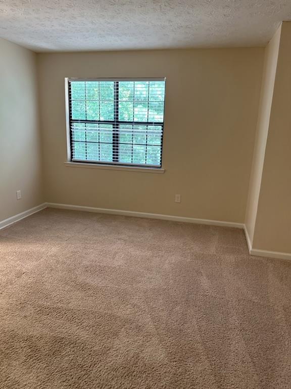 5956 North Castlegate Drive Atlanta, GA 30349 - Photo 23 of 28 an empty room with a window