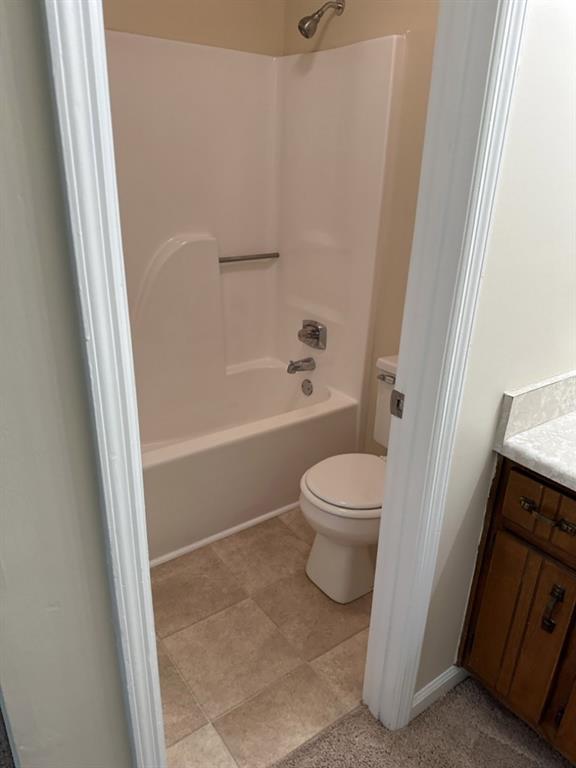 5956 North Castlegate Drive Atlanta, GA 30349 - Photo 25 of 28 a bathroom with a toilet and a shower