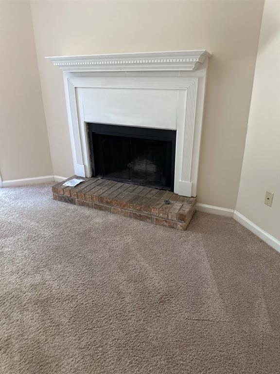 5956 North Castlegate Drive Atlanta, GA 30349 - Photo 4 of 28 a living room with a fireplace