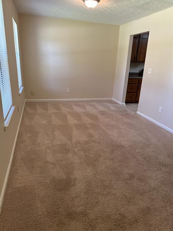 5956 North Castlegate Drive Atlanta, GA 30349 - Photo 5 of 28 an empty room with a window