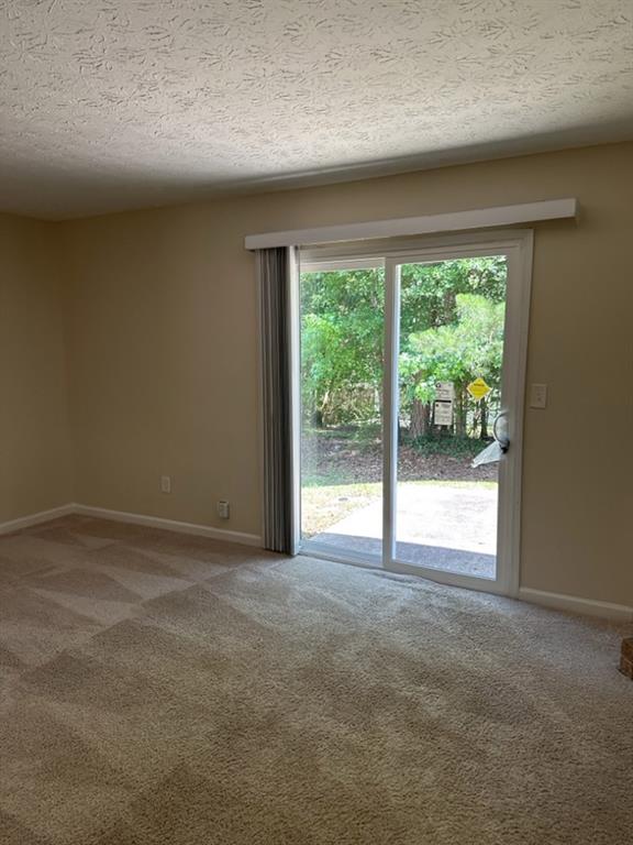 5956 North Castlegate Drive Atlanta, GA 30349 - Photo 10 of 28 a view of empty room with front door