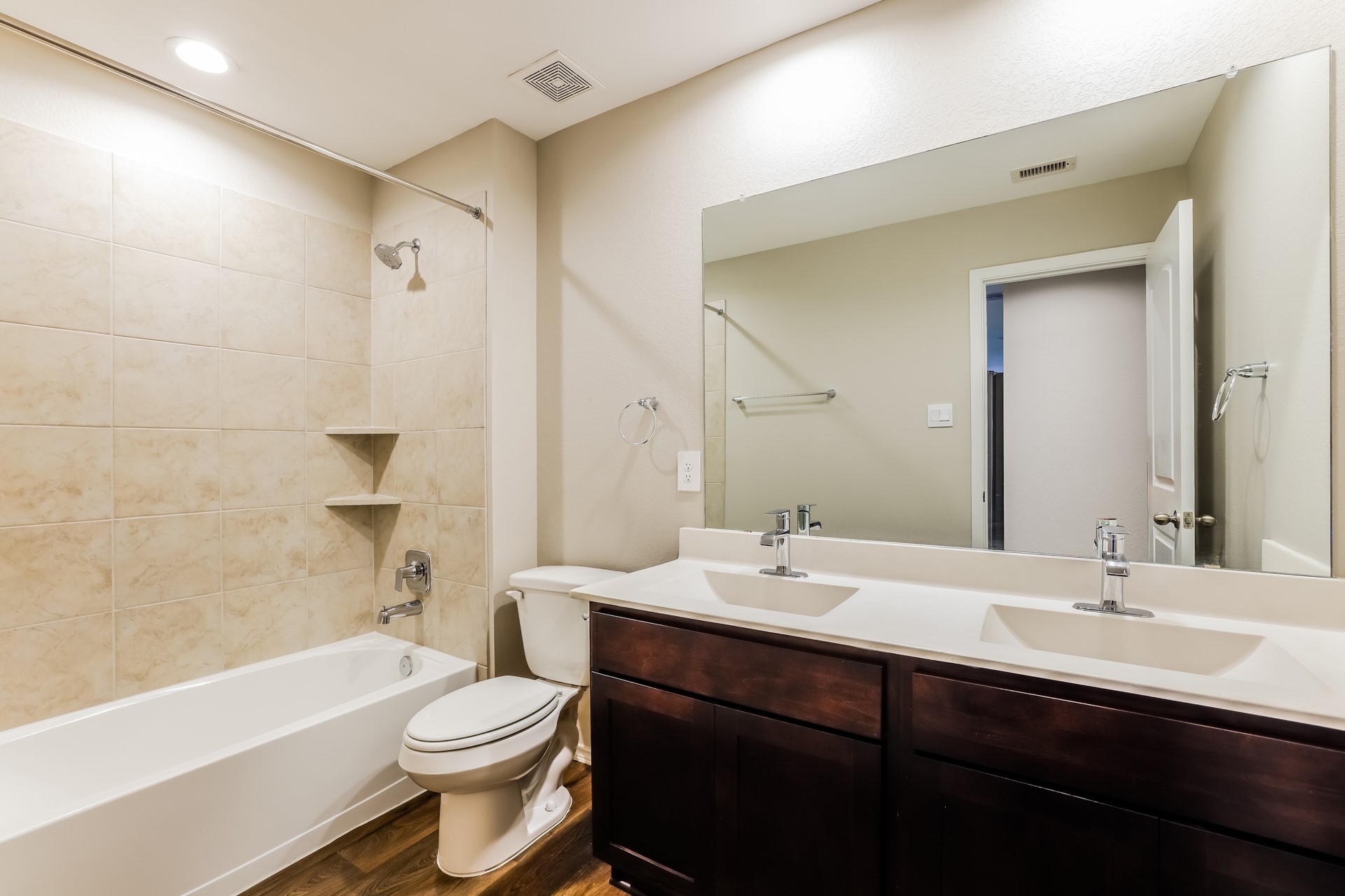 10011 Lavender Lane Magnolia, TX 77355 - Photo 13 of 15 a bathroom with a sink a toilet a mirror a bathtub and shower