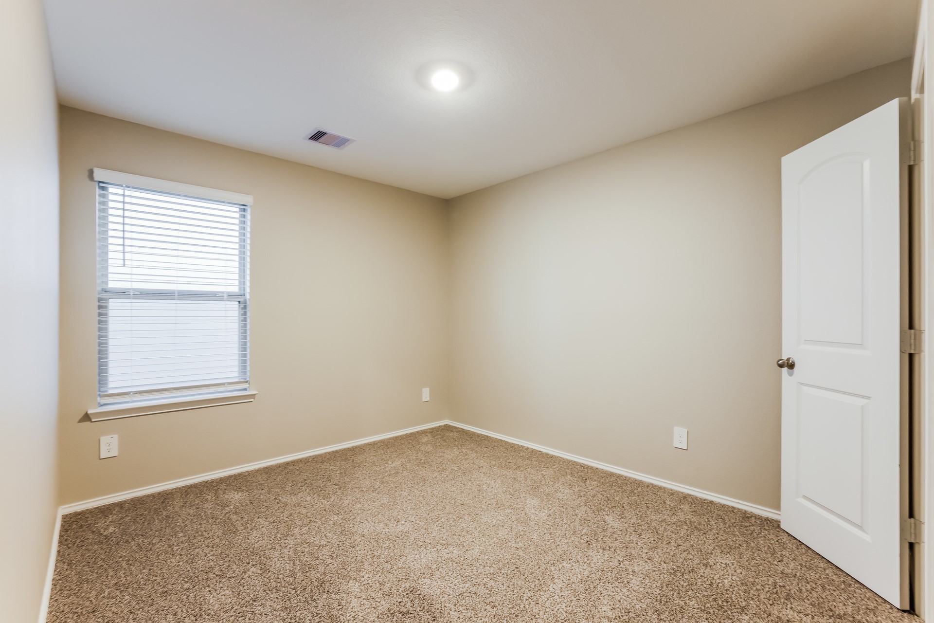 10011 Lavender Lane Magnolia, TX 77355 - Photo 14 of 15 an empty room with windows