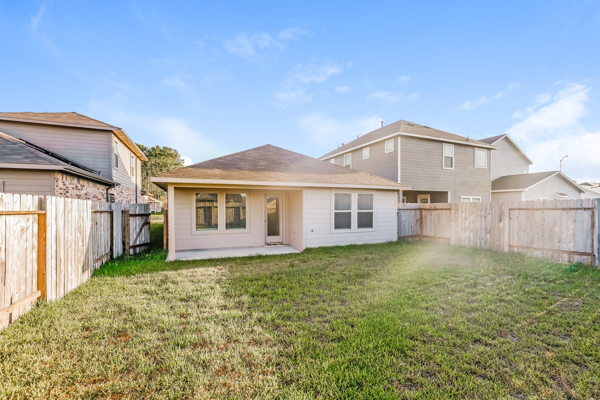10011 Lavender Lane Magnolia, TX 77355 - Photo 15 of 15 a view of a yard in front of a house with plants and wooden fence