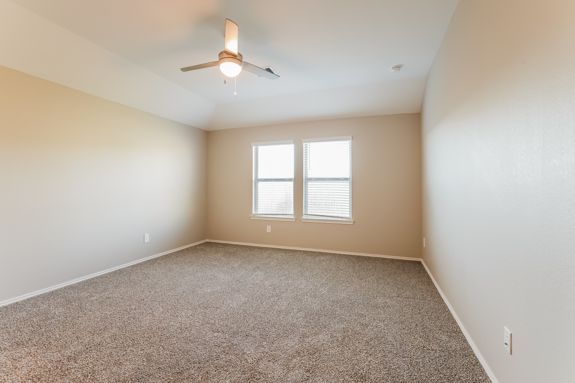 10011 Lavender Lane Magnolia, TX 77355 - Photo 7 of 15 an empty room with a window and a fan