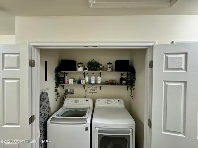 a utility room with dryer and washer