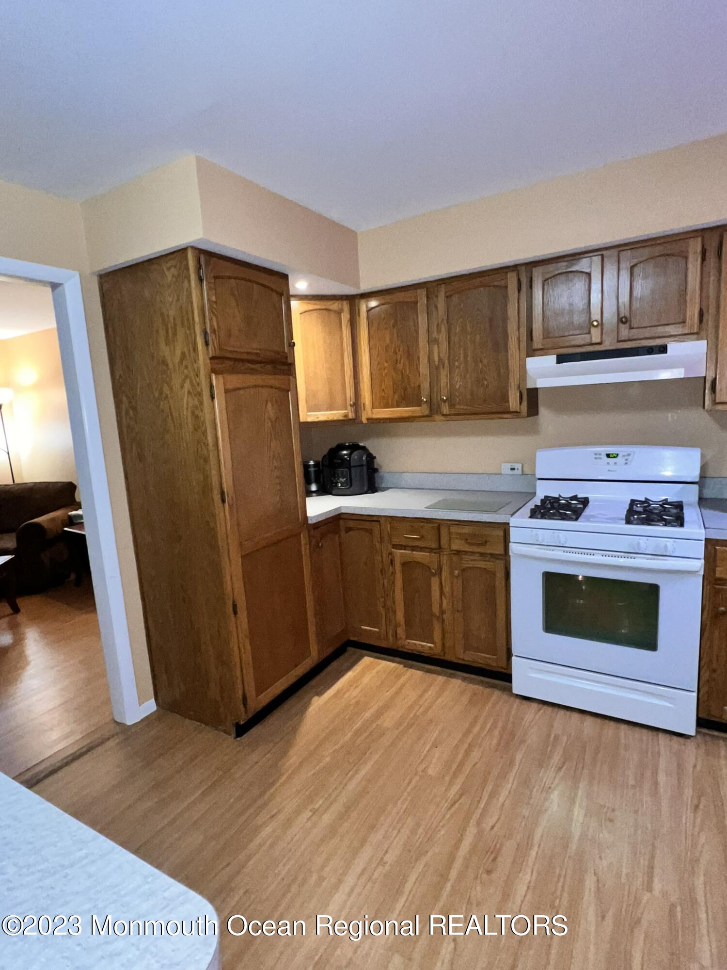 515 Eastern Boulevard Bayville, NJ 08721 - Photo 12 of 38 a kitchen with stainless steel appliances a stove a sink and a refrigerator