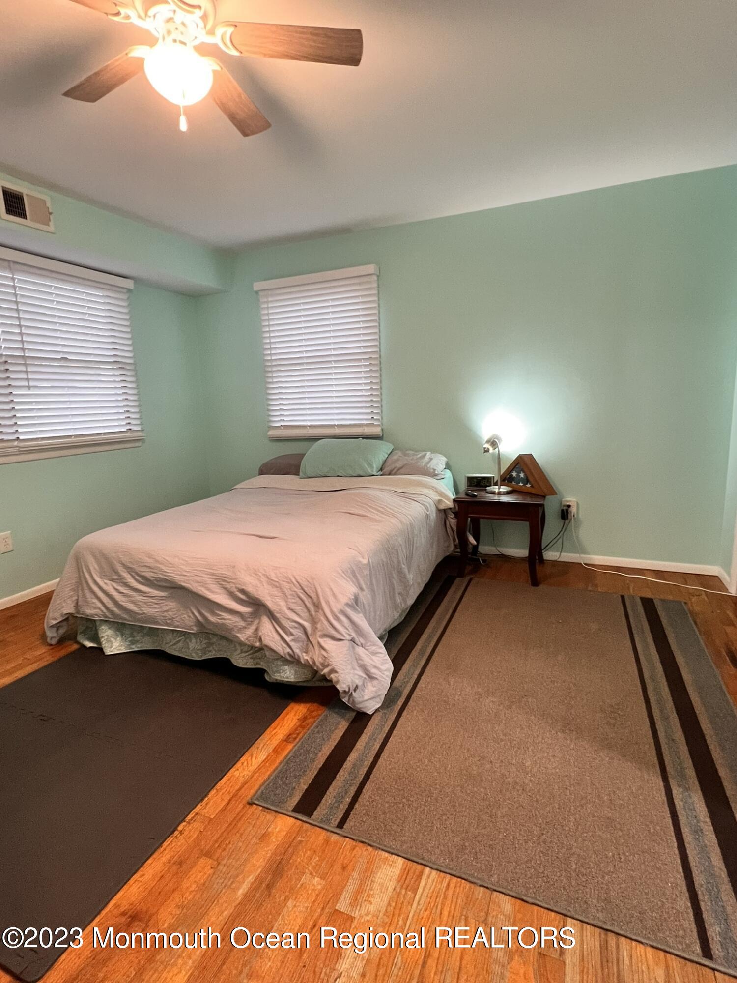 515 Eastern Boulevard Bayville, NJ 08721 - Photo 13 of 38 a bedroom with a bed and window