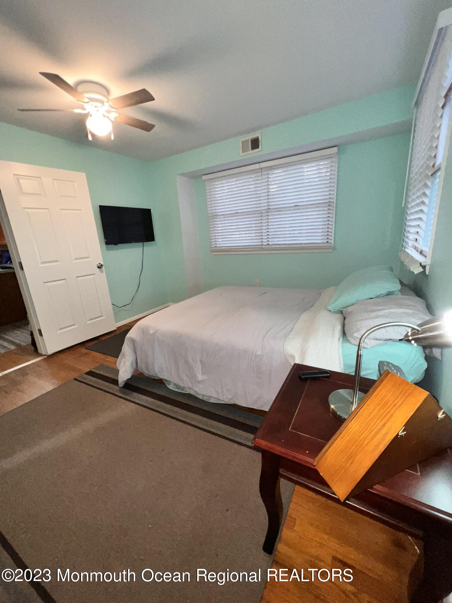515 Eastern Boulevard Bayville, NJ 08721 - Photo 15 of 38 a bedroom with a bed and a television