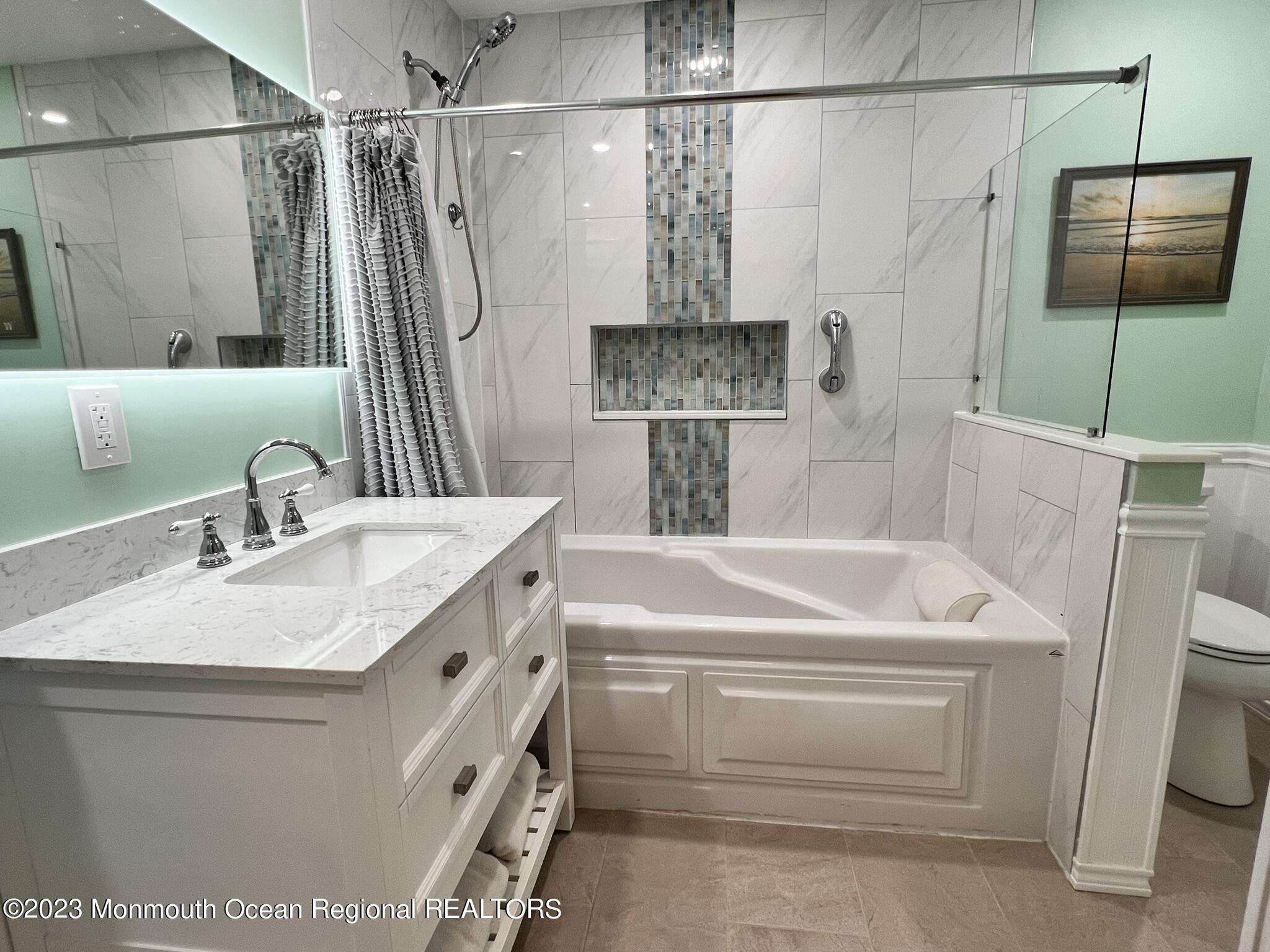 515 Eastern Boulevard Bayville, NJ 08721 - Photo 16 of 38 a bathroom with a sink a toilet and shower