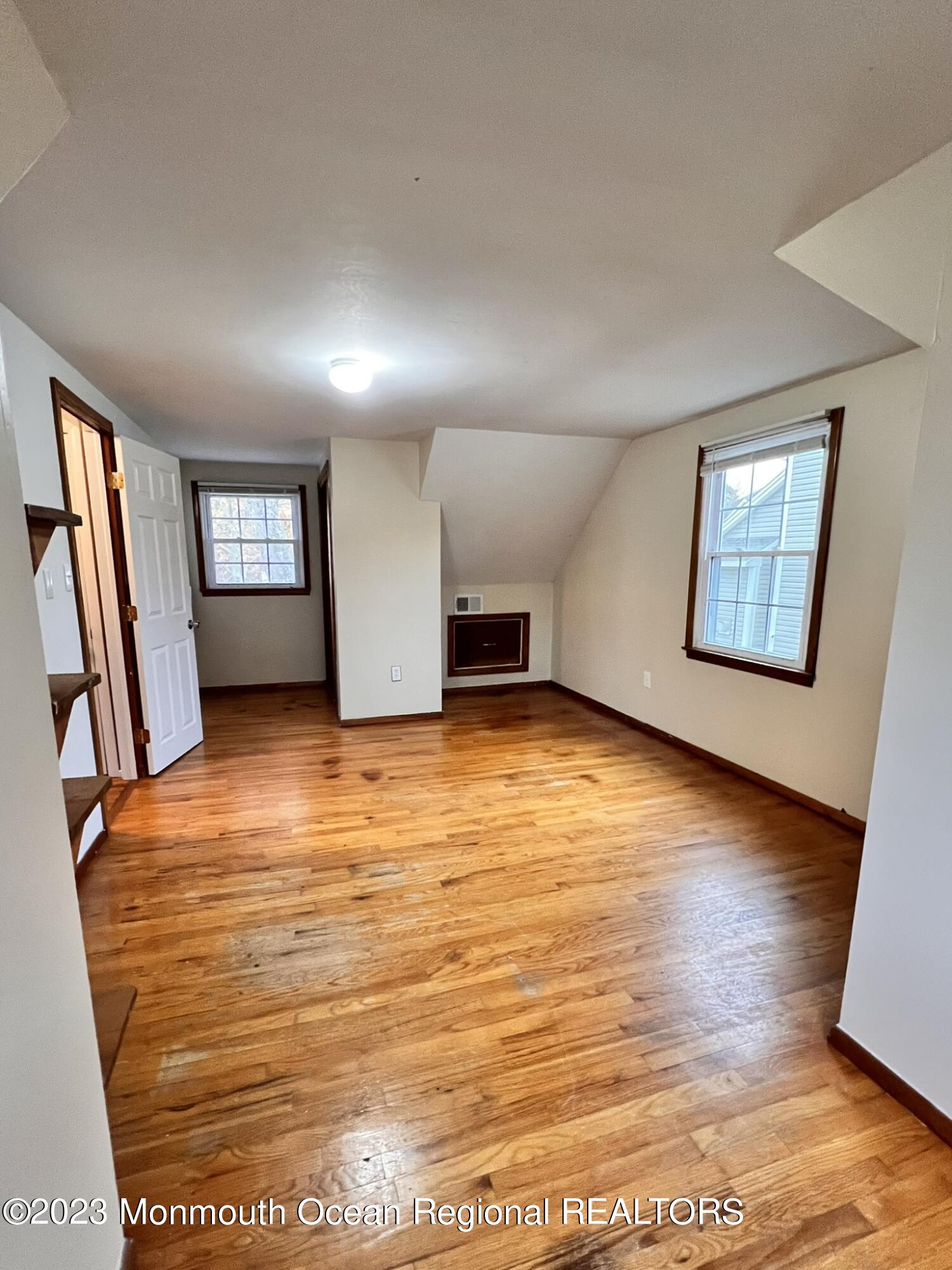 515 Eastern Boulevard Bayville, NJ 08721 - Photo 26 of 38 a view of an empty room with window and wooden floor