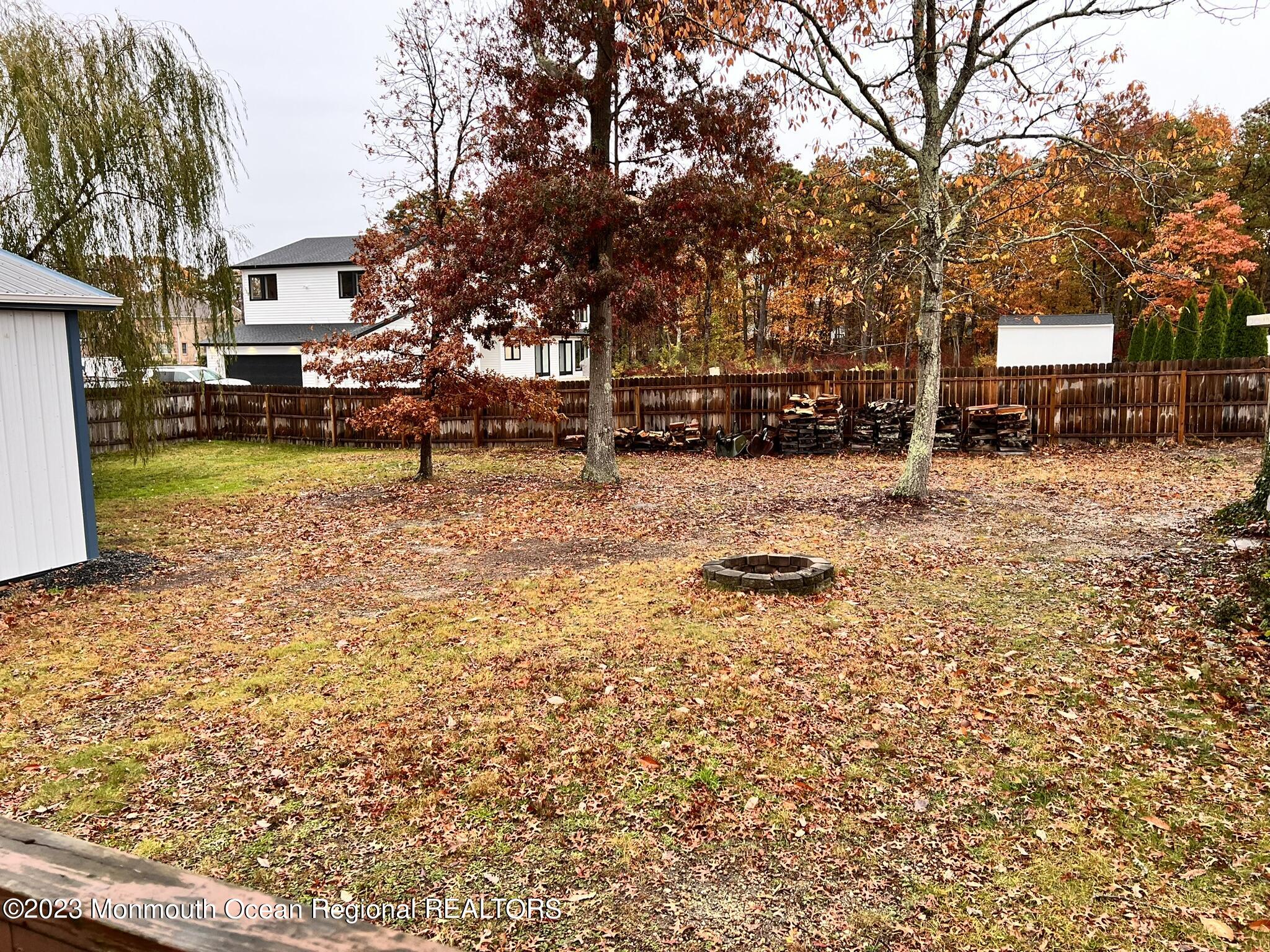 515 Eastern Boulevard Bayville, NJ 08721 - Photo 29 of 38 a tall tree in middle of a yard