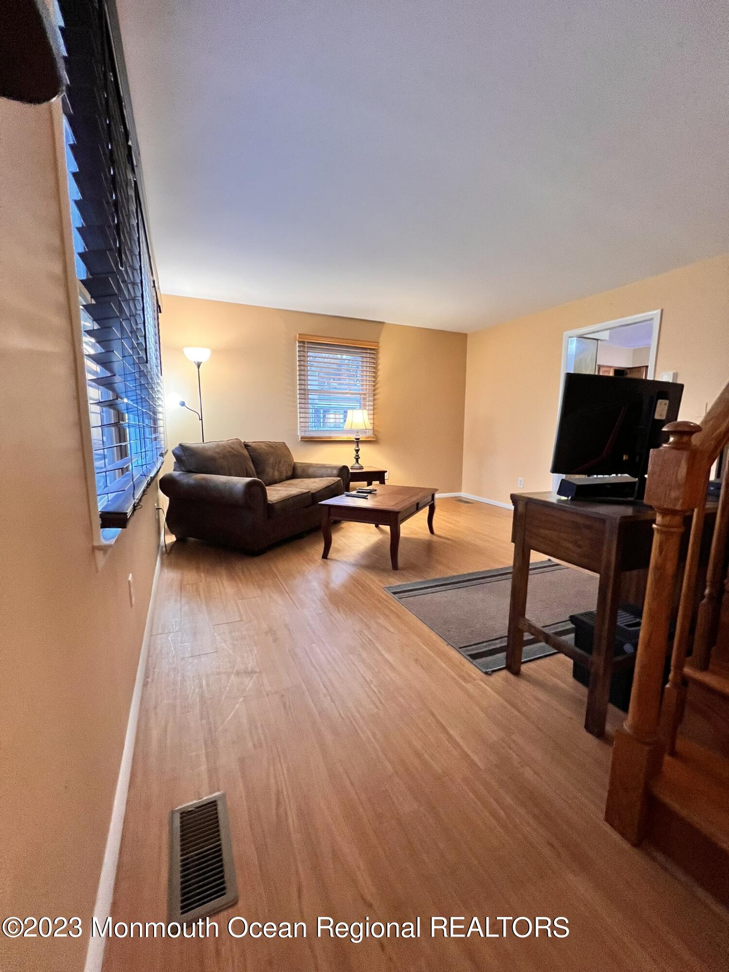 515 Eastern Boulevard Bayville, NJ 08721 - Photo 3 of 38 a living room with furniture and a flat screen tv