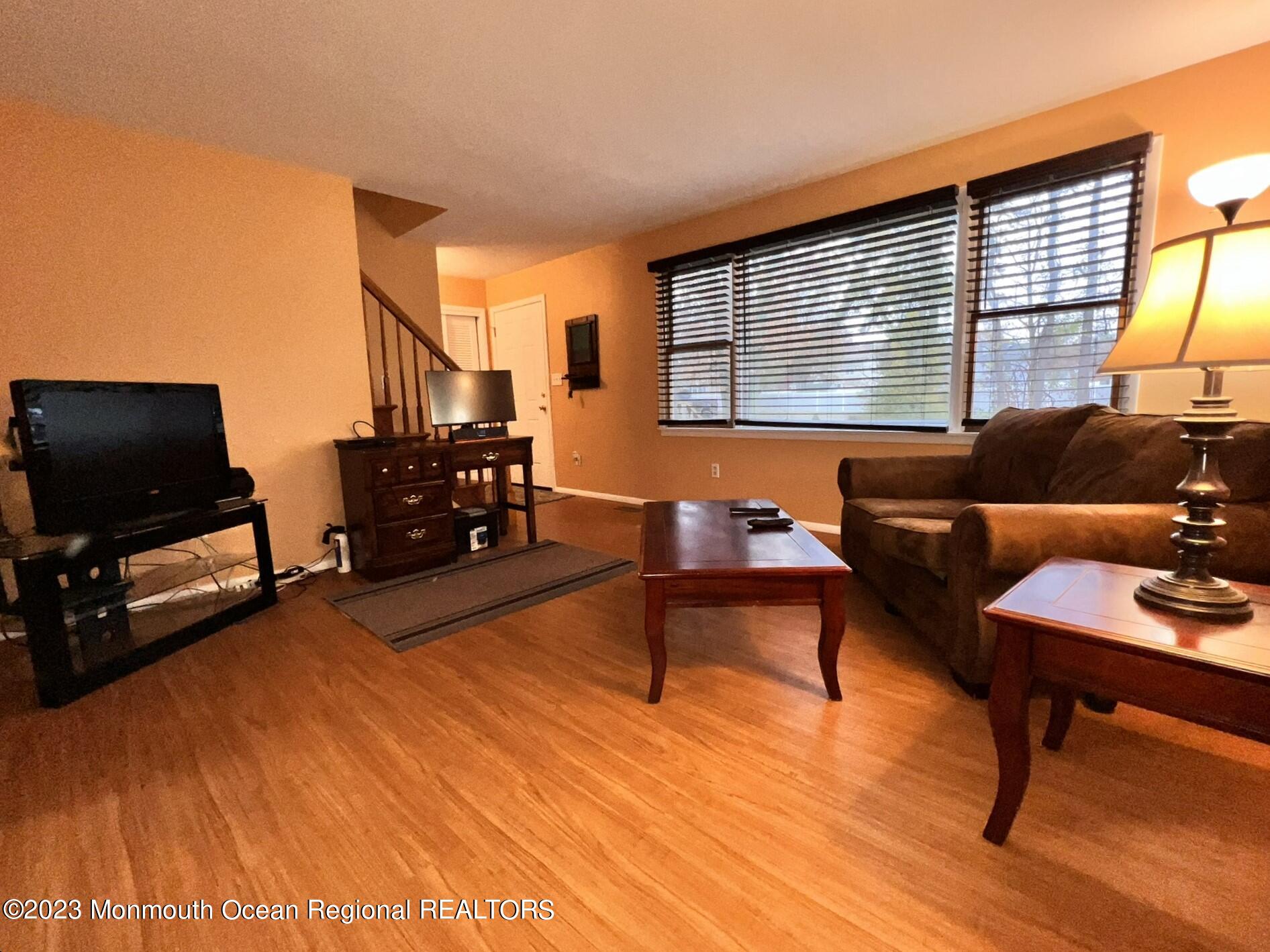 515 Eastern Boulevard Bayville, NJ 08721 - Photo 5 of 38 a living room with furniture and a flat screen tv
