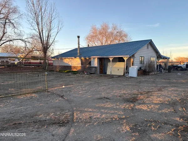 a view of a house with a back yard