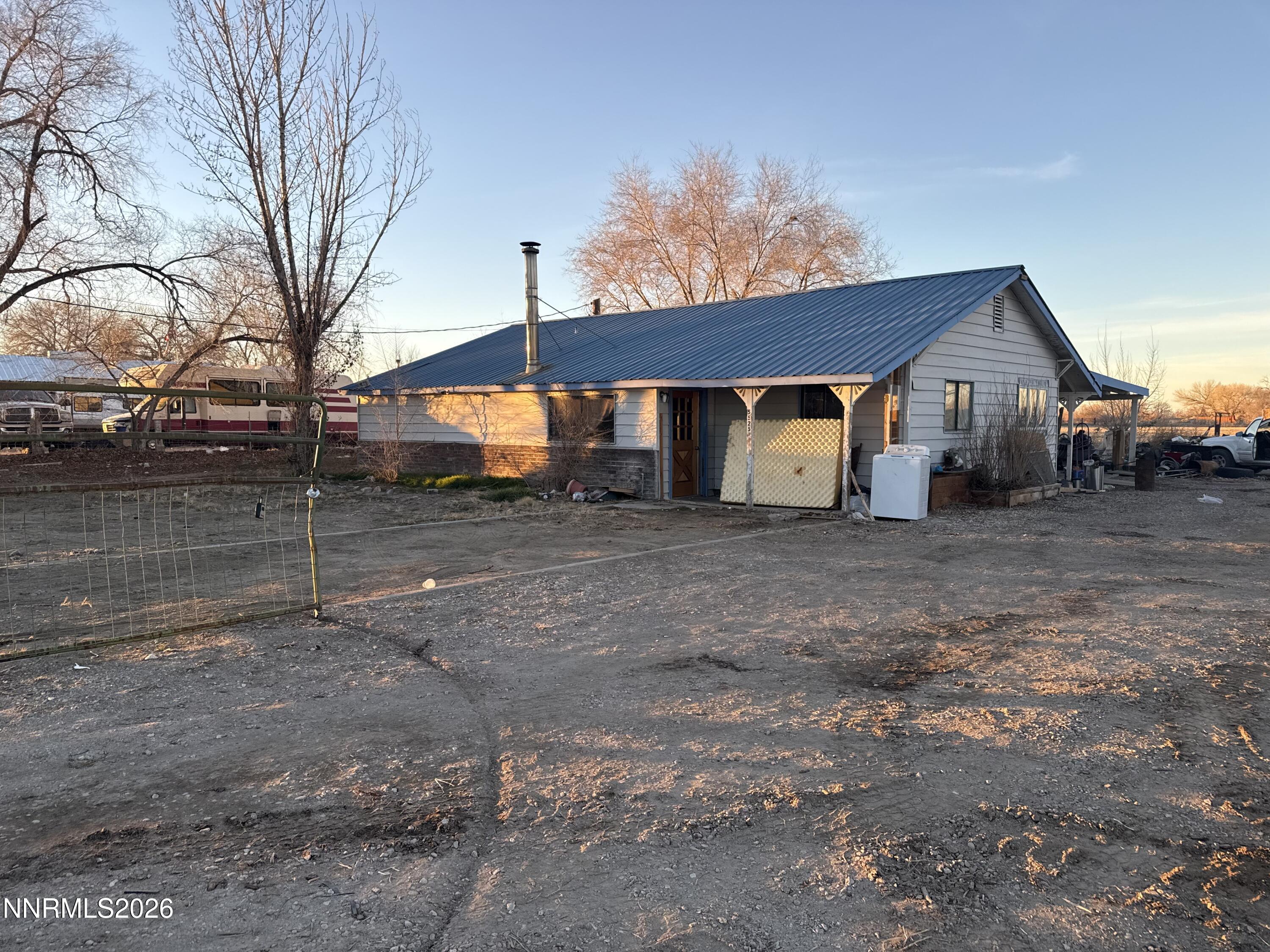 a view of a house with a back yard