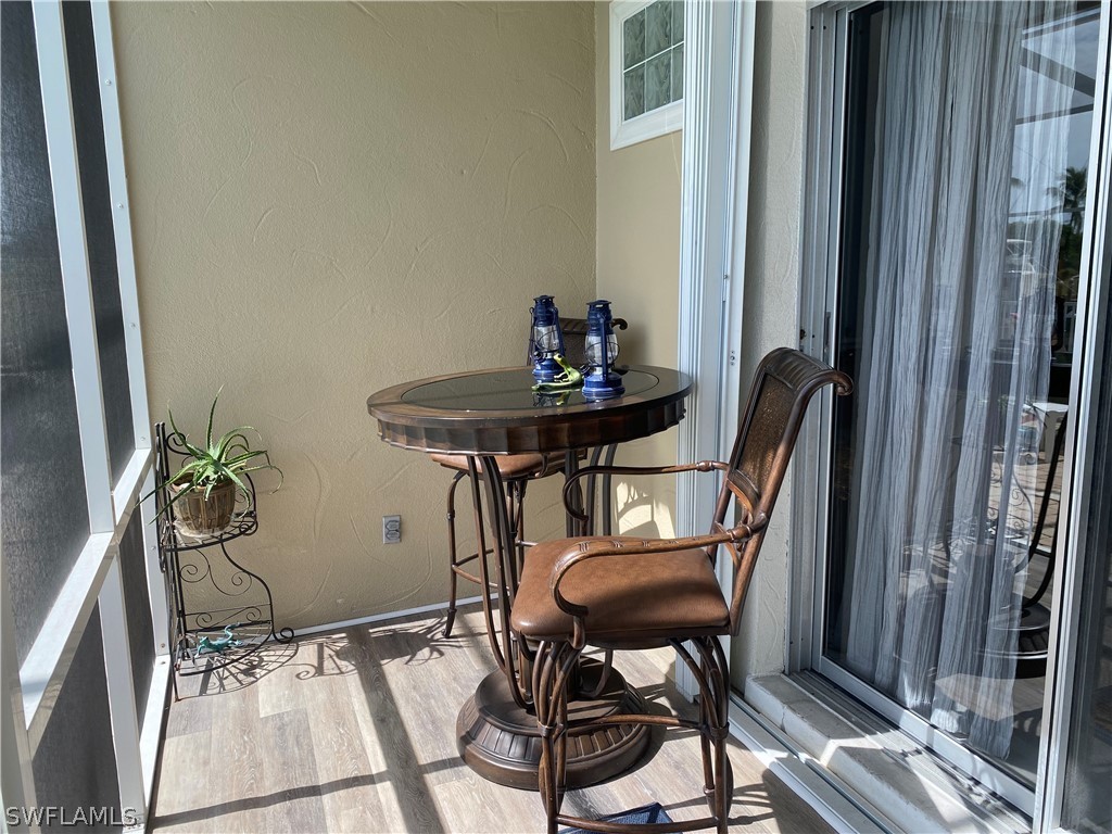 3211 Stringfellow Road, Unit 1D St. James City, FL 33956 - Photo 14 of 22 a view of a workspace with furniture and a window