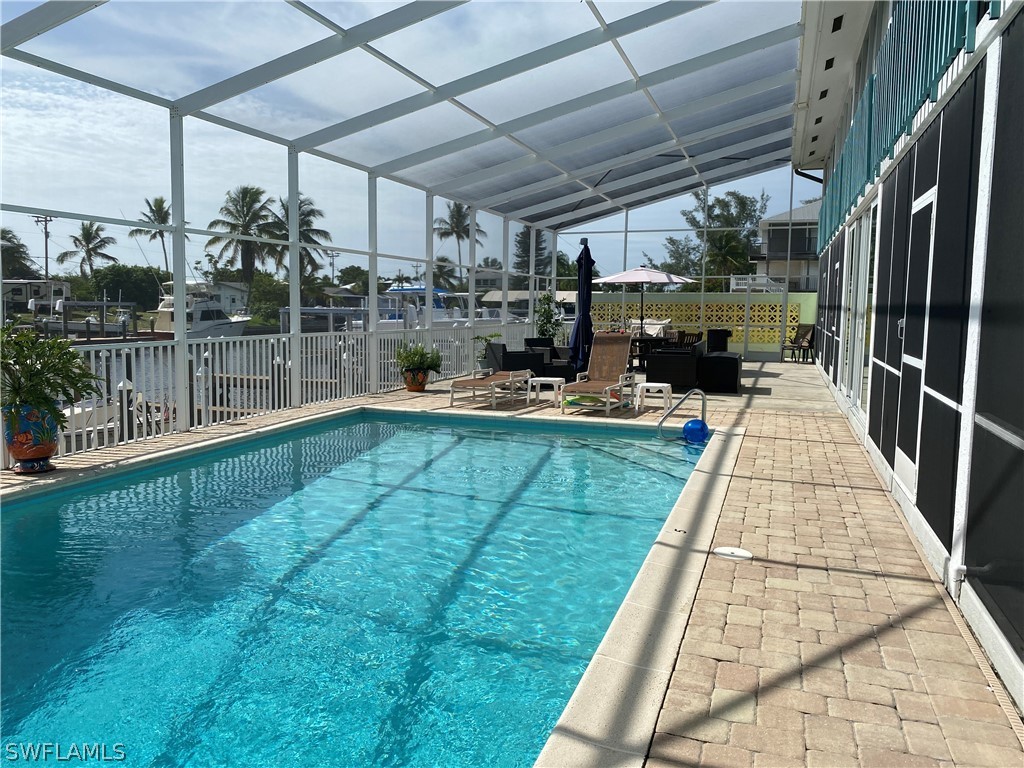 3211 Stringfellow Road, Unit 1D St. James City, FL 33956 - Photo 17 of 22 a view of a backyard