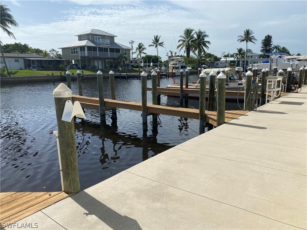 3211 Stringfellow Road, Unit 1D St. James City, FL 33956 - Photo 19 of 22 a view of a balcony with many chairs