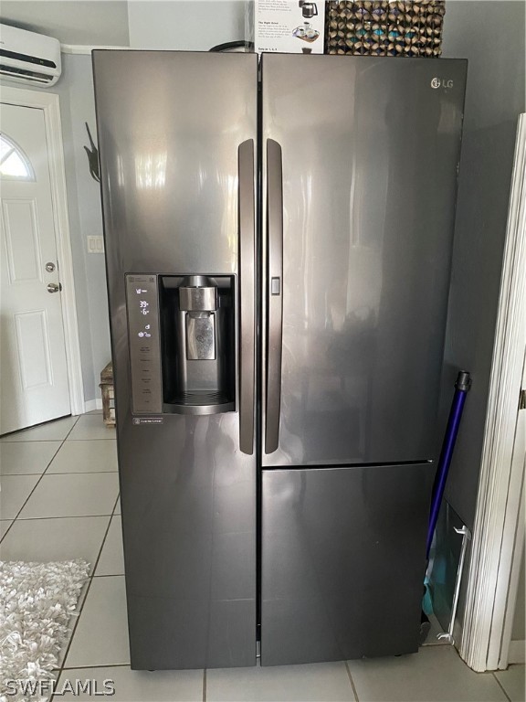 3211 Stringfellow Road, Unit 1D St. James City, FL 33956 - Photo 2 of 22 a view of a refrigerator in kitchen and an empty room