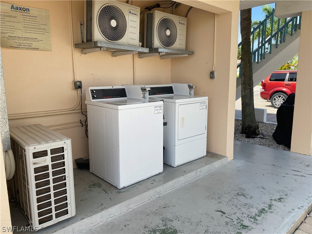 3211 Stringfellow Road, Unit 1D St. James City, FL 33956 - Photo 22 of 22 a view of storage and utility room with washer and dryer