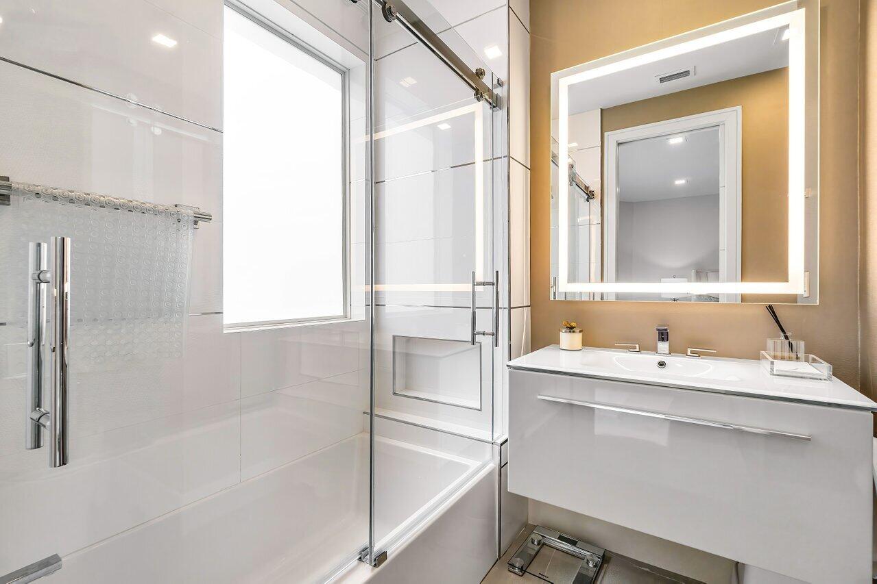 3506 Northwest Clubside Circle Boca Raton, FL 33496 - Photo 15 of 46 a bathroom with a sink and a mirror