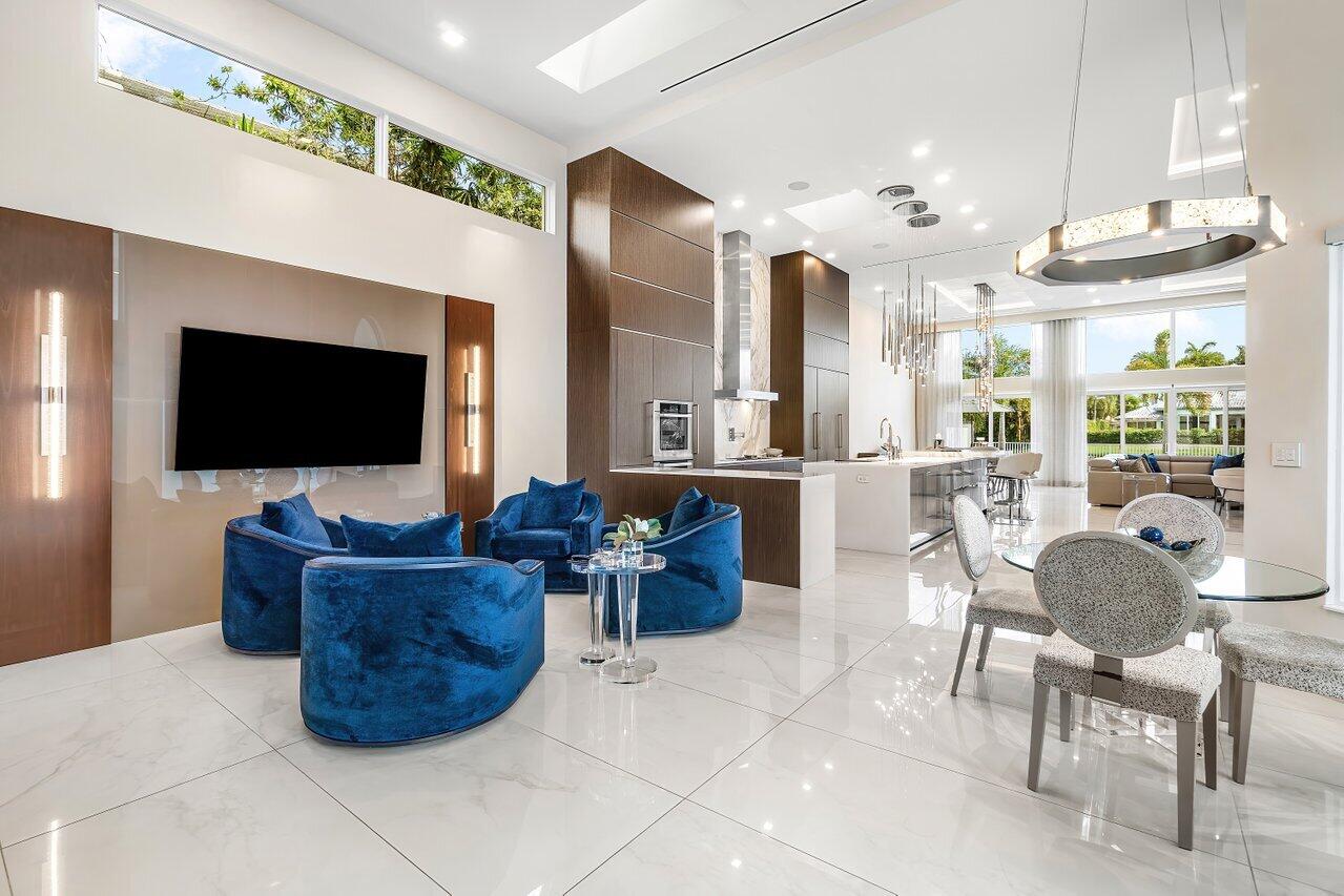 3506 Northwest Clubside Circle Boca Raton, FL 33496 - Photo 4 of 46 a living room with furniture and a flat screen tv