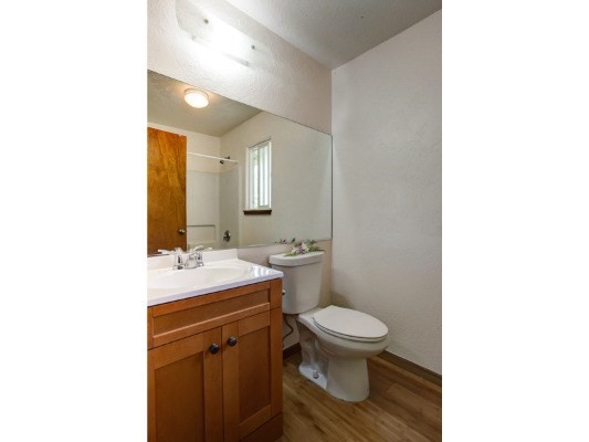 6490 Kipapa Road, Unit B Kapaa, HI 96746 - Photo 13 of 24 a bathroom with a toilet sink and mirror