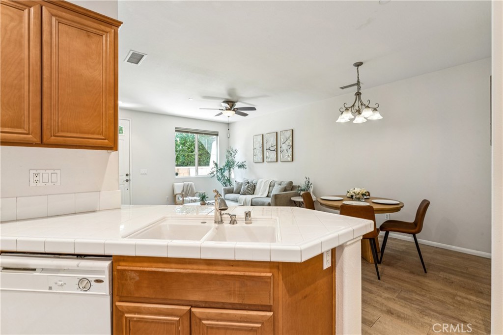 8048 Tulsa Place, Unit 105 Rancho Cucamonga, CA 91730 - Photo 14 of 45 a kitchen with a sink and cabinets