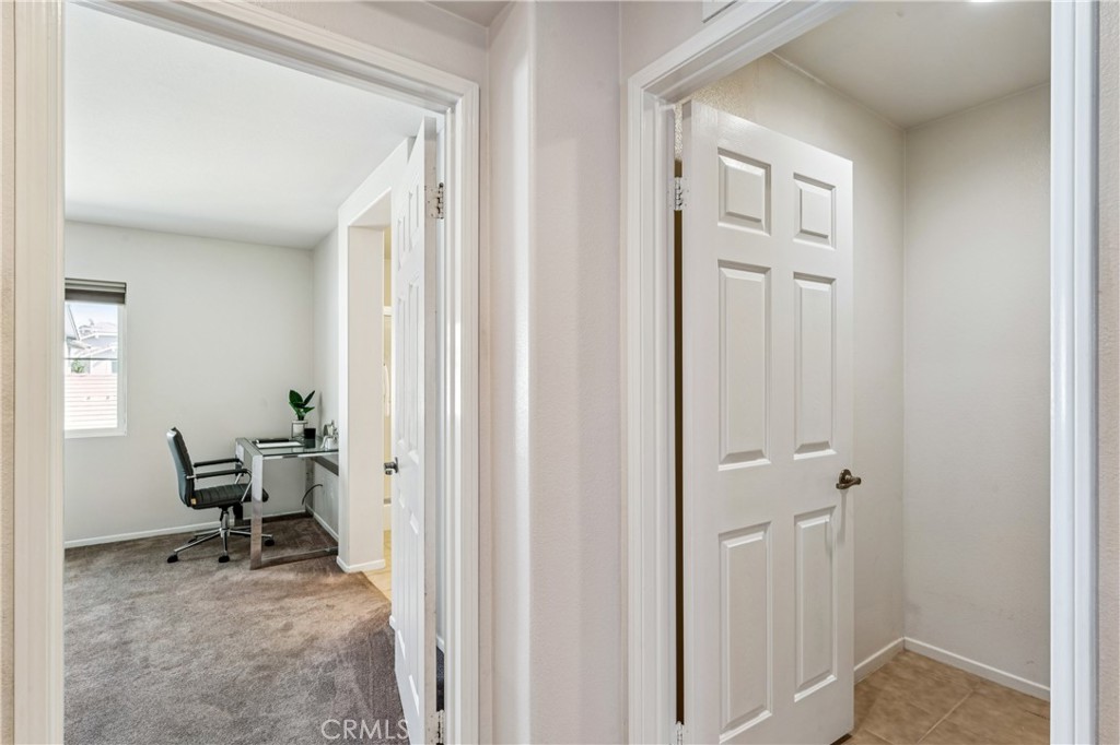 8048 Tulsa Place, Unit 105 Rancho Cucamonga, CA 91730 - Photo 23 of 45 a view of a hallway with workspace and a hallway