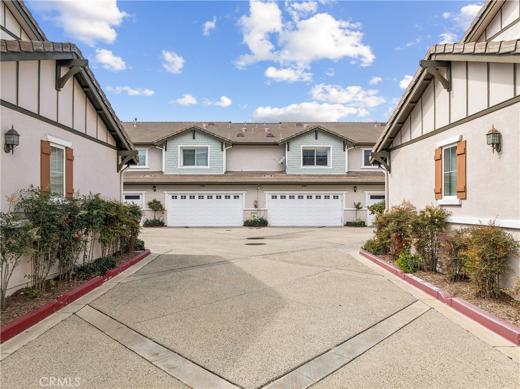 8048 Tulsa Place, Unit 105 Rancho Cucamonga, CA 91730 - Photo 34 of 45 a view of white house with a large space in front of it