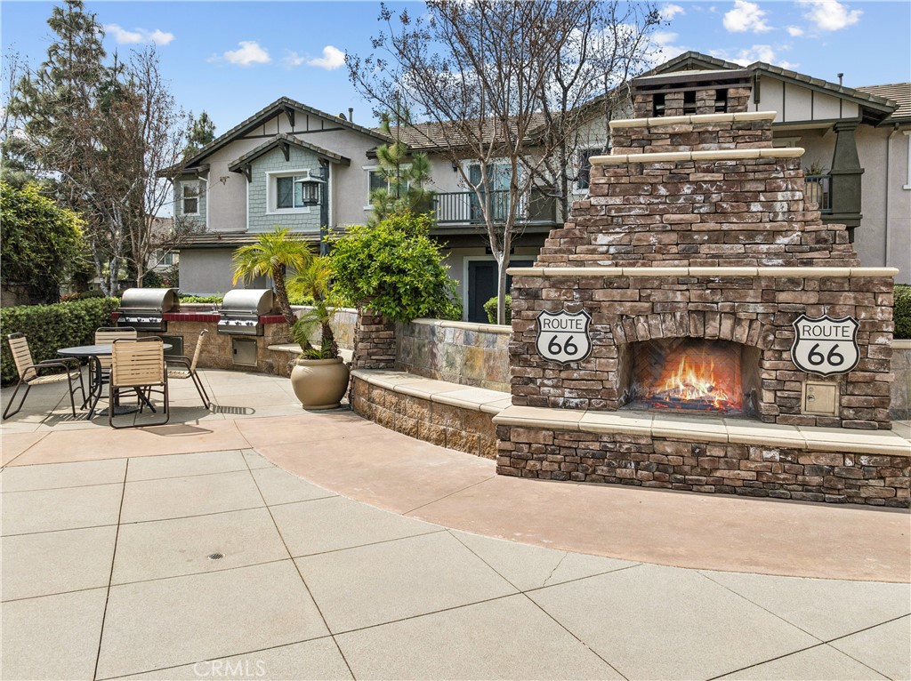 8048 Tulsa Place, Unit 105 Rancho Cucamonga, CA 91730 - Photo 37 of 45 a view of a building with a bench in front of it