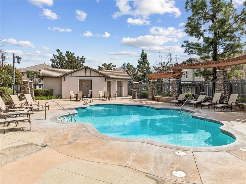 8048 Tulsa Place, Unit 105 Rancho Cucamonga, CA 91730 - Photo 38 of 45 a view of a house with swimming pool and sitting area