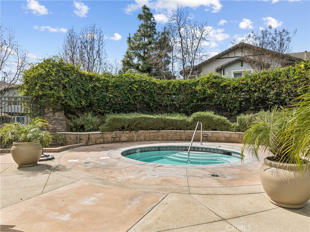 8048 Tulsa Place, Unit 105 Rancho Cucamonga, CA 91730 - Photo 39 of 45 a backyard of a house with outdoor seating and entertaining space