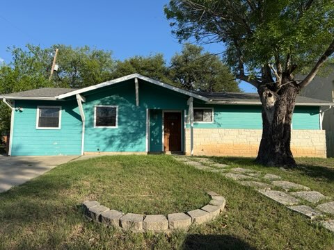 5609 Gloucester Lane Austin, TX 78723 - Photo 1 of 7 a view of a house with a yard