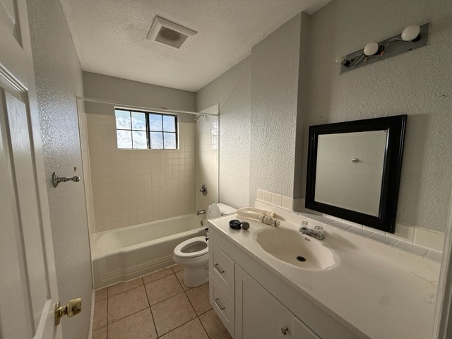 5609 Gloucester Lane Austin, TX 78723 - Photo 5 of 7 a bathroom with a sink a toilet and shower