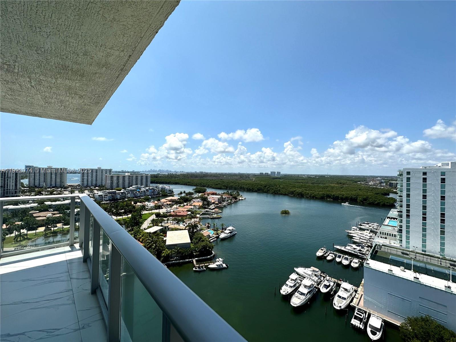 330 Sunny Isles Boulevard, Unit 52002 Sunny Isles Beach, FL 33160 - Photo 25 of 56 a view of a balcony with chairs