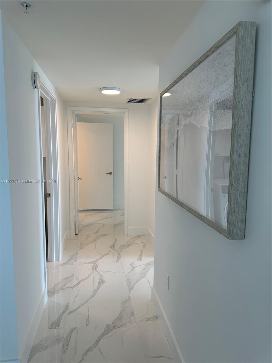 330 Sunny Isles Boulevard, Unit 52002 Sunny Isles Beach, FL 33160 - Photo 35 of 56 a view of a hallway