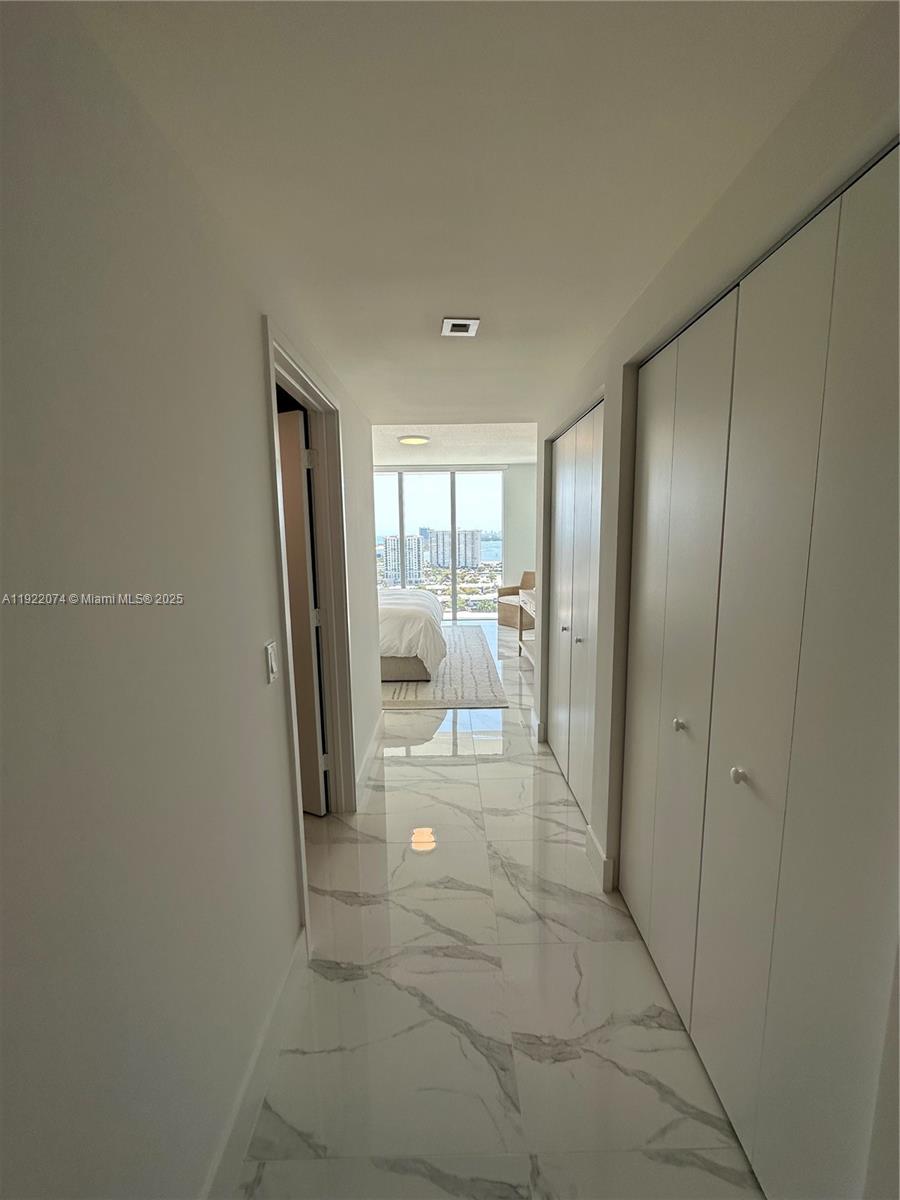 330 Sunny Isles Boulevard, Unit 52002 Sunny Isles Beach, FL 33160 - Photo 43 of 56 a view of a hallway