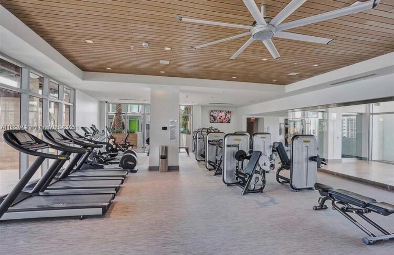 330 Sunny Isles Boulevard, Unit 52002 Sunny Isles Beach, FL 33160 - Photo 56 of 56 a view of a room with gym equipment