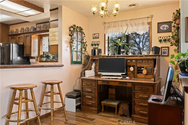 a kitchen with a refrigerator and a sink