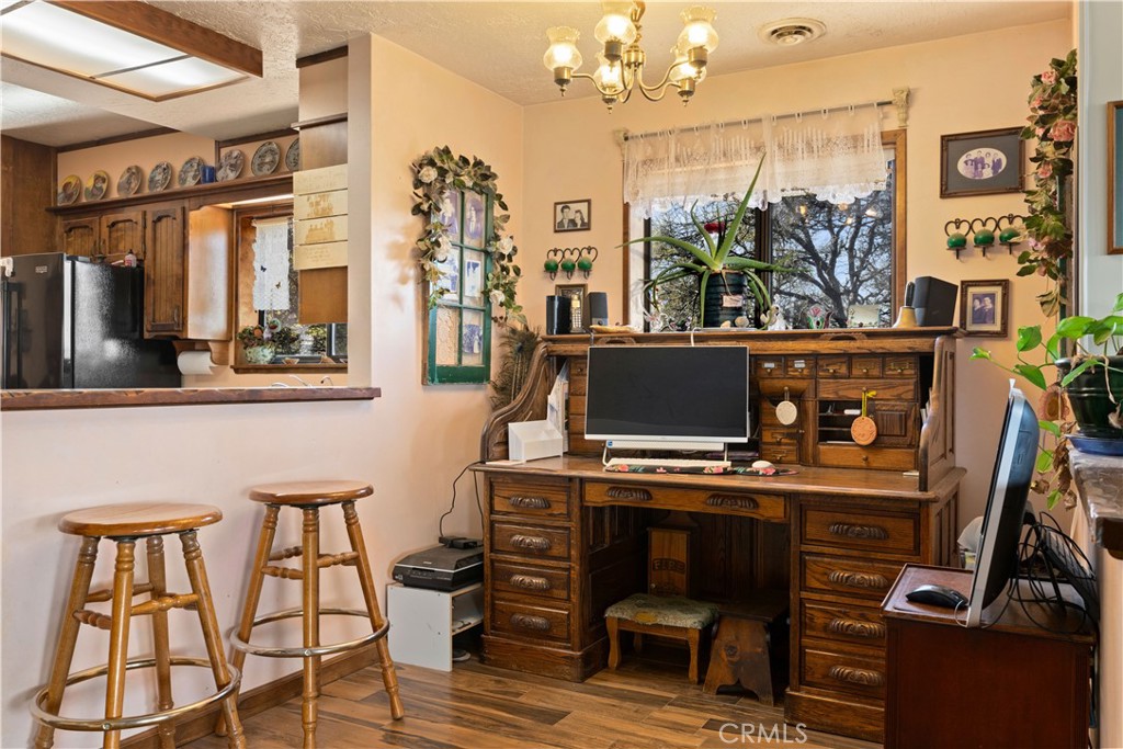 340 Fritch Road Lakeport, CA 95453 - Photo 11 of 65 a view of a dining room with furniture and chandelier