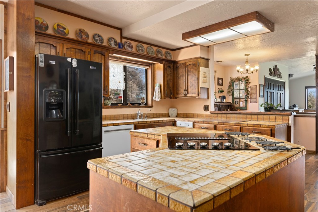 340 Fritch Road Lakeport, CA 95453 - Photo 14 of 65 a kitchen with a refrigerator and a sink