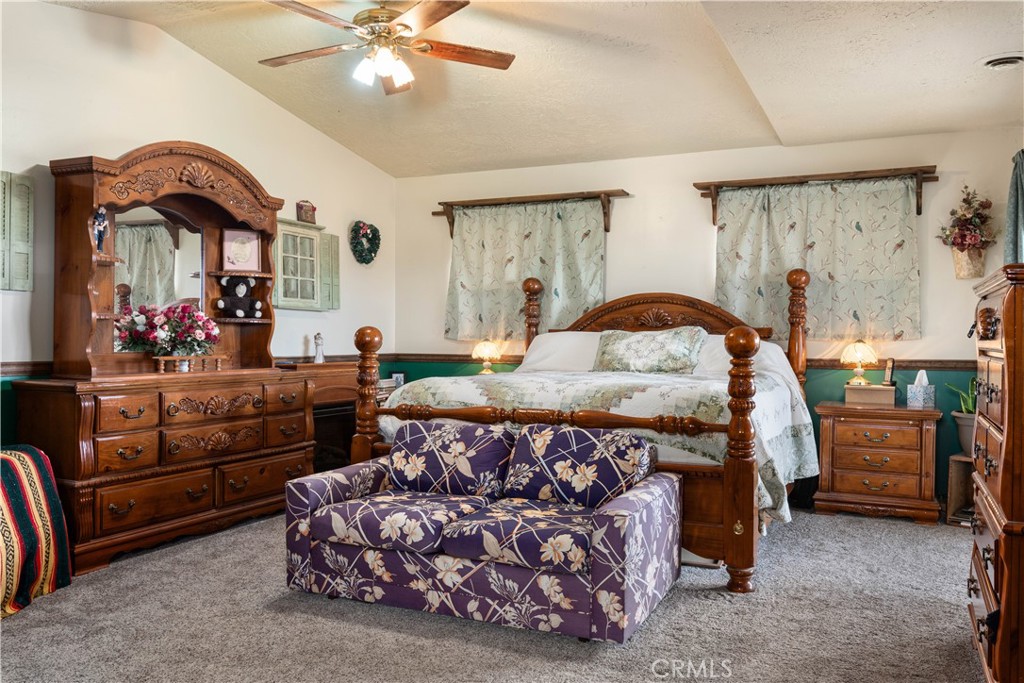 340 Fritch Road Lakeport, CA 95453 - Photo 20 of 65 a bedroom with furniture and a chandelier