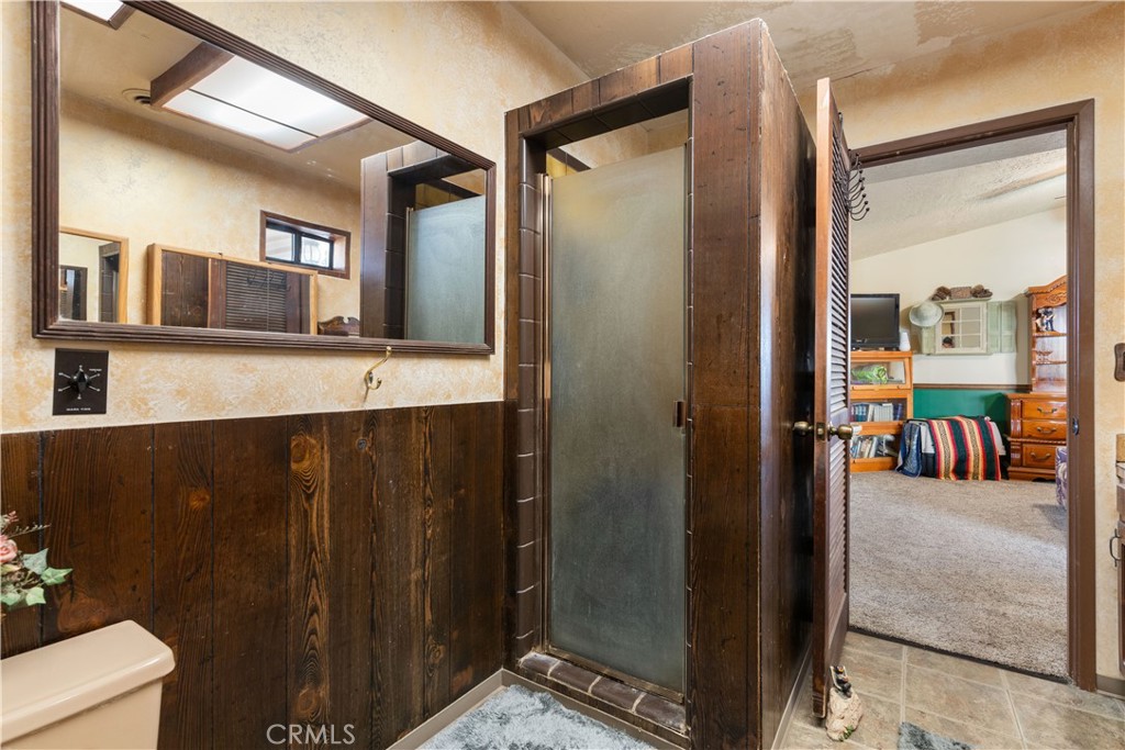 340 Fritch Road Lakeport, CA 95453 - Photo 22 of 65 a bathroom with a double vanity sink and a mirror