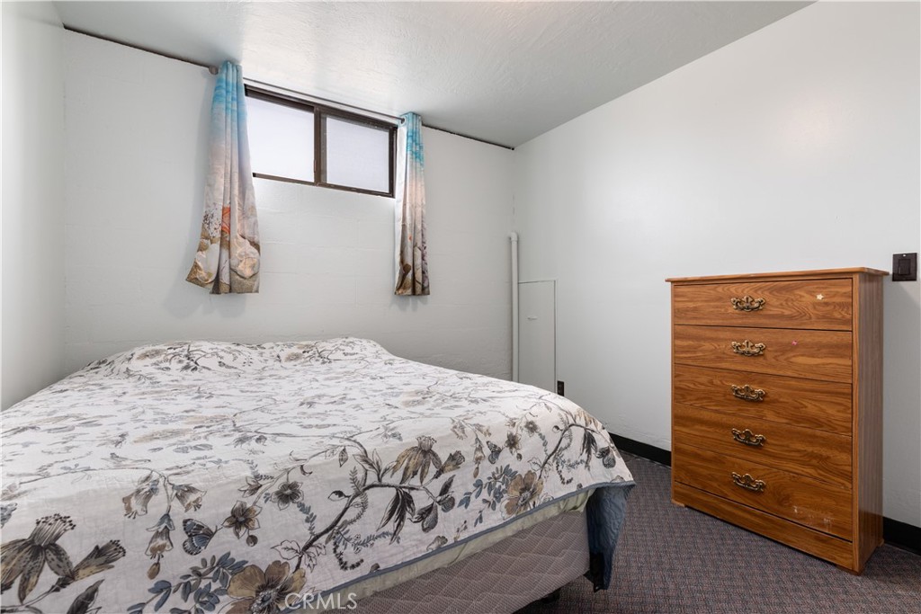 340 Fritch Road Lakeport, CA 95453 - Photo 27 of 65 a bedroom with a bed and a window