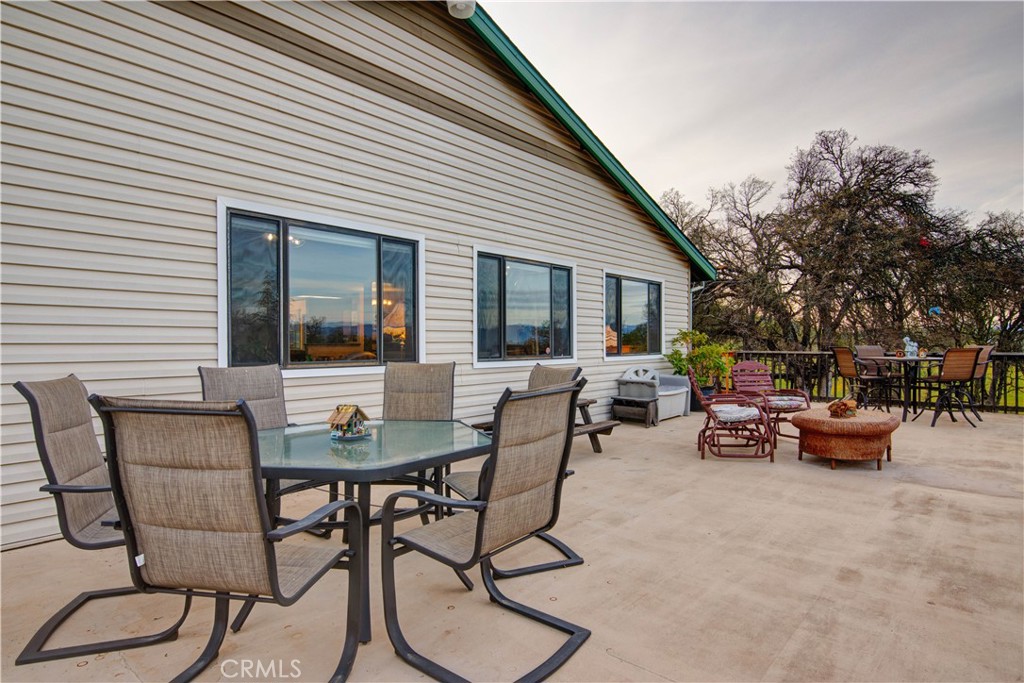 340 Fritch Road Lakeport, CA 95453 - Photo 29 of 65 a view of a patio with table and chairs and potted plants
